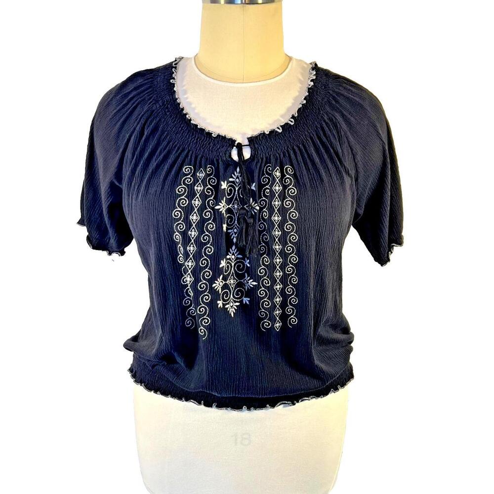 The French Laundry Blouse is a stylish and comfortable women's peasant top in si